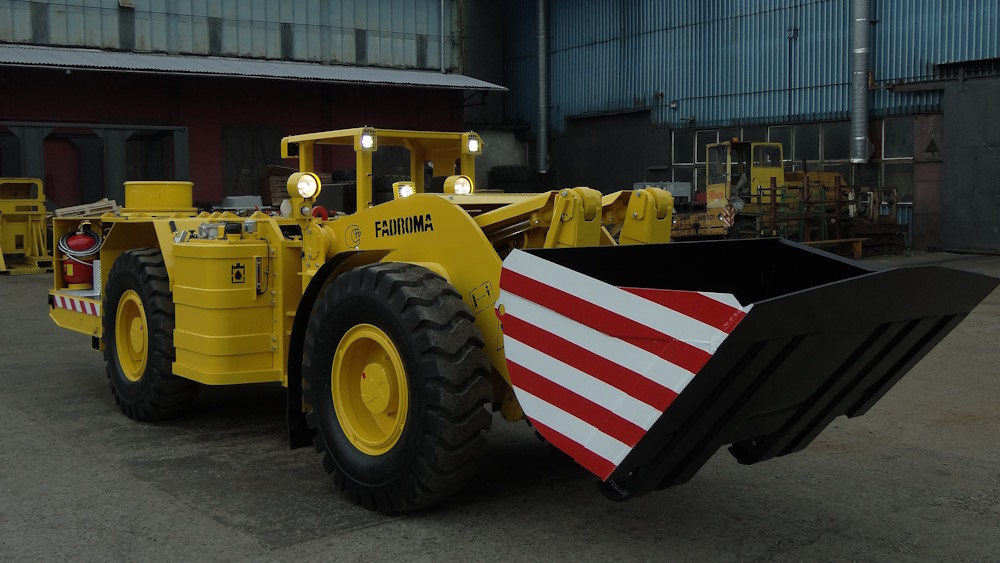 LK1 mining loader in front of a manufacturing plant